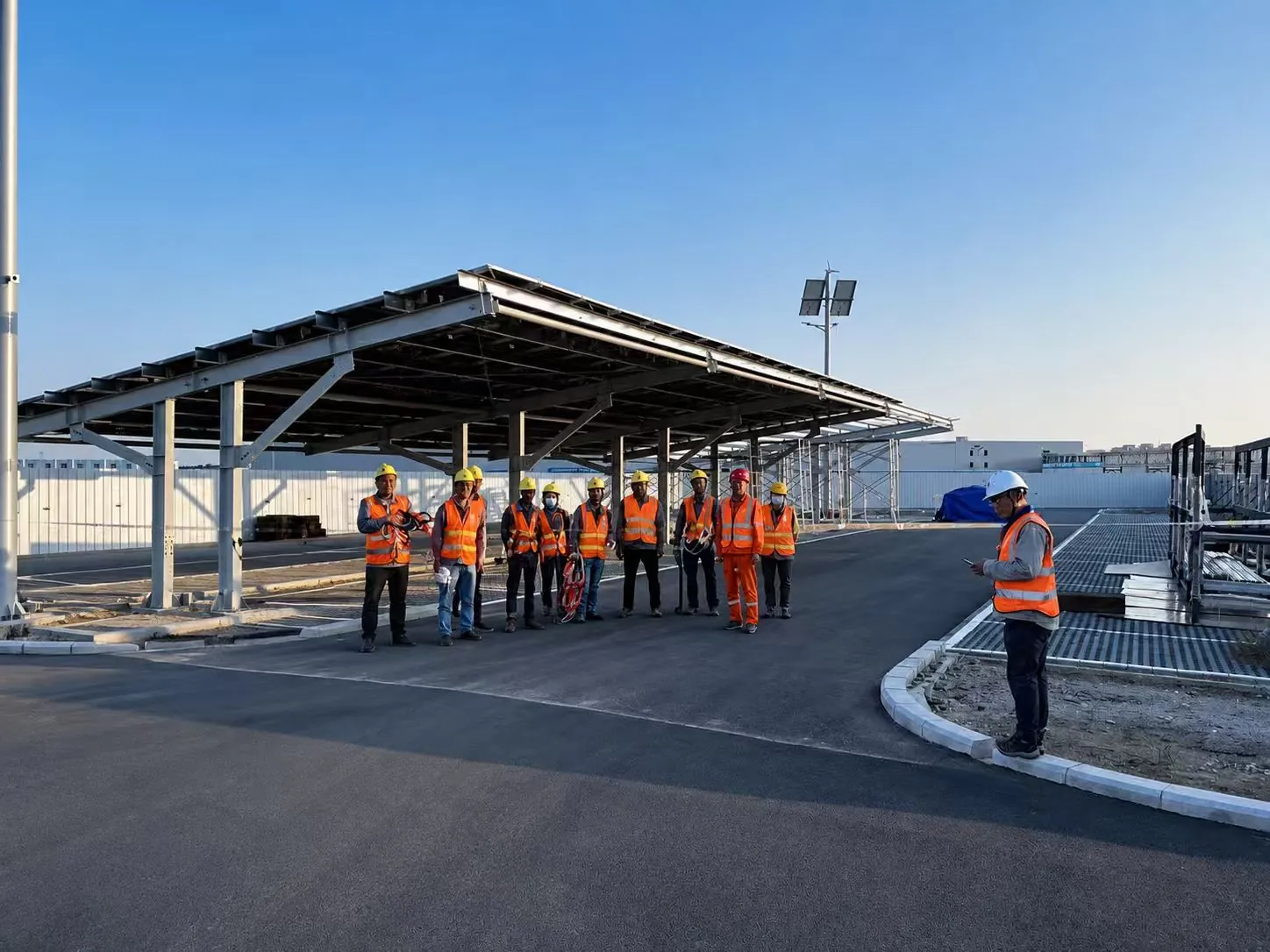The finished solar carport with the site crew in front of it